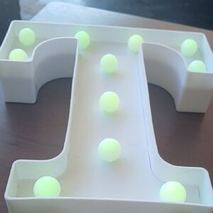 White Letter T Light with Yellow Bulbs